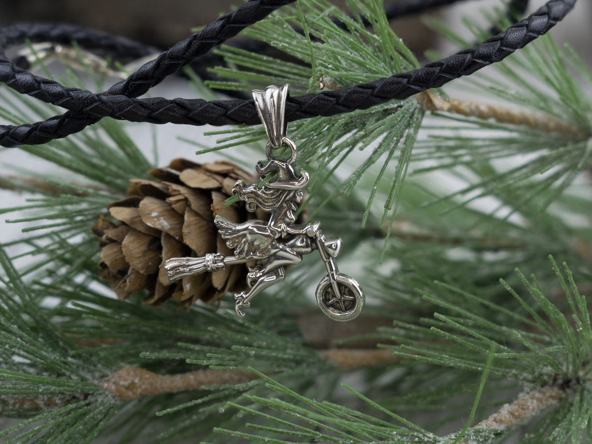 Allegra sterling silver witch pendant, side view of the motorcycle