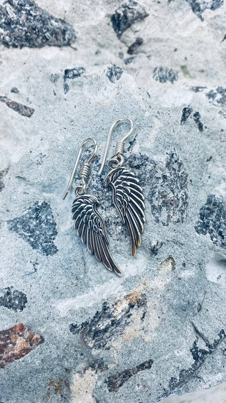 Sterling silver angel wings dangle earrings hanging from coiled French wire hooks