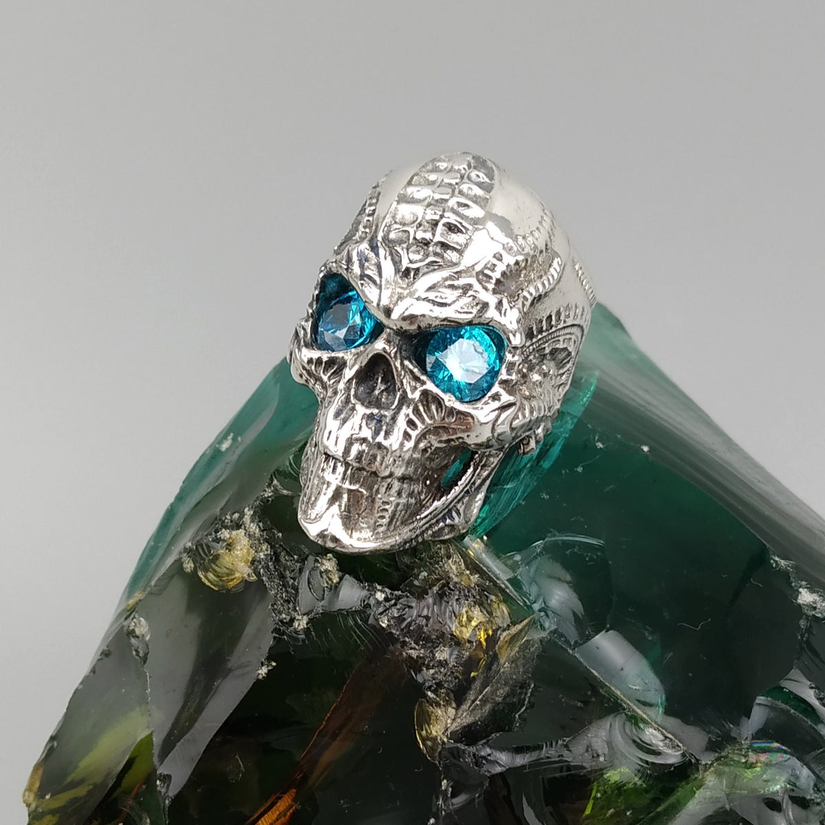 Blade biomechanical skull ring with light blue cubic zirconia eyes