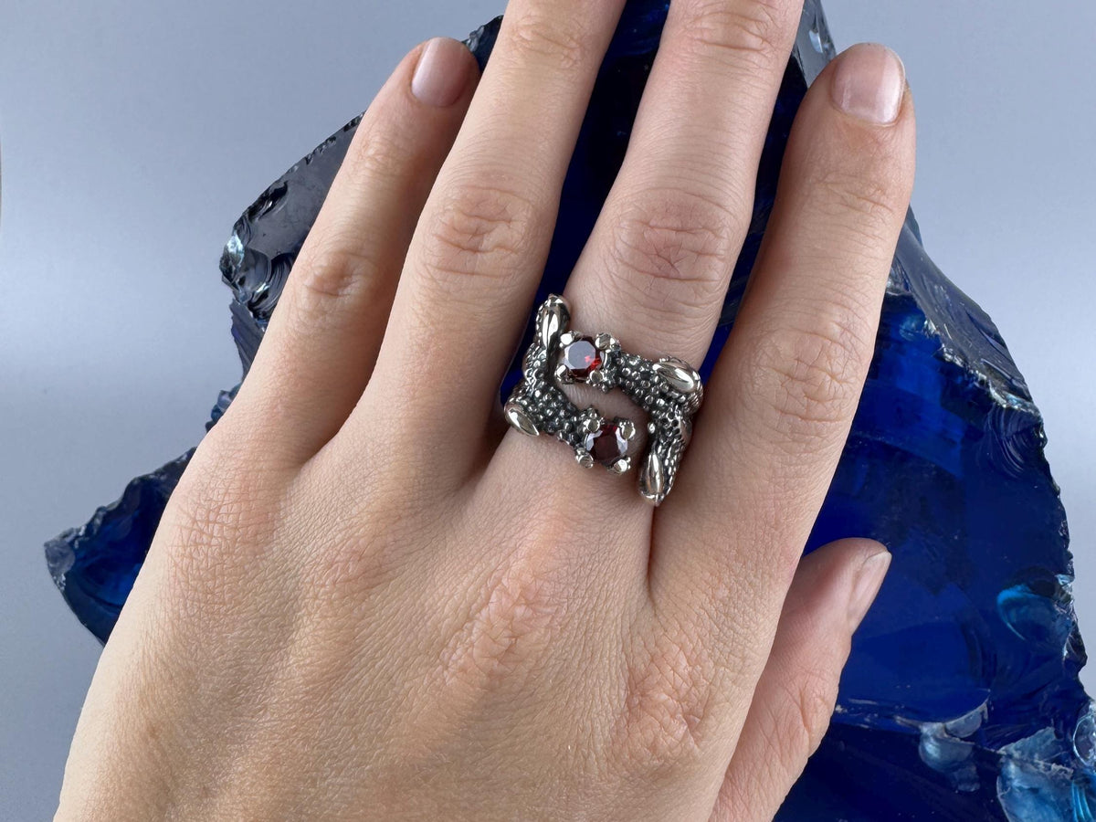 Crimson Claw dragon ring worn on a woman's hand