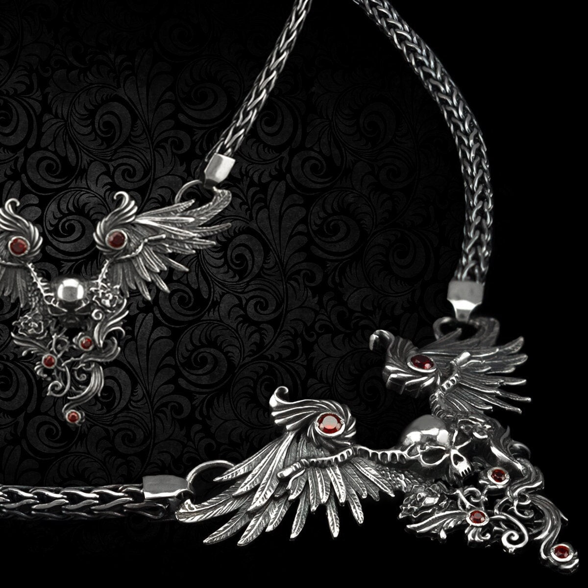 Dark Angel women's silver necklace with thick woven chain and winged skull centerpiece
