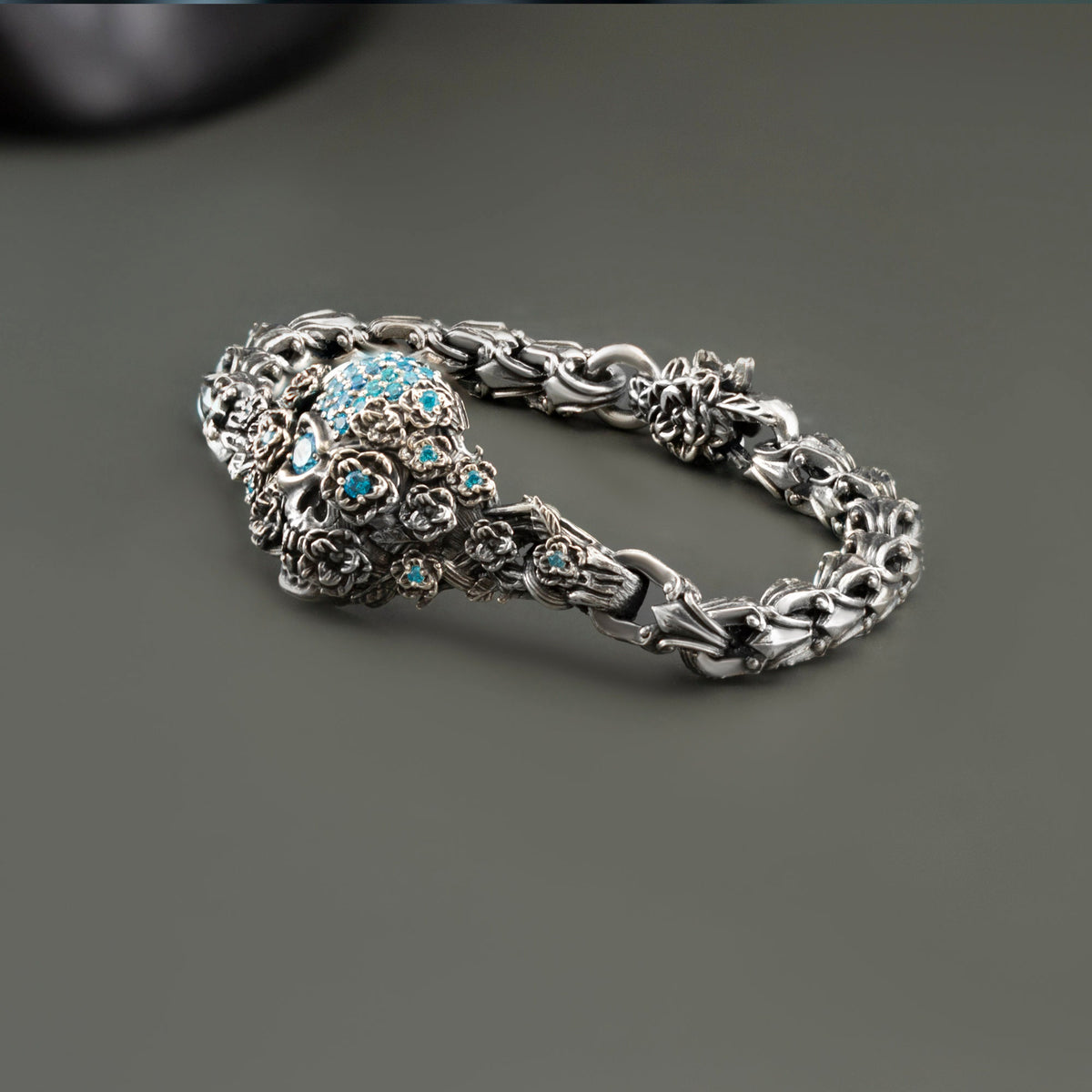 Frida sugar skull bracelet, angled view of the jeweled skull and rose links