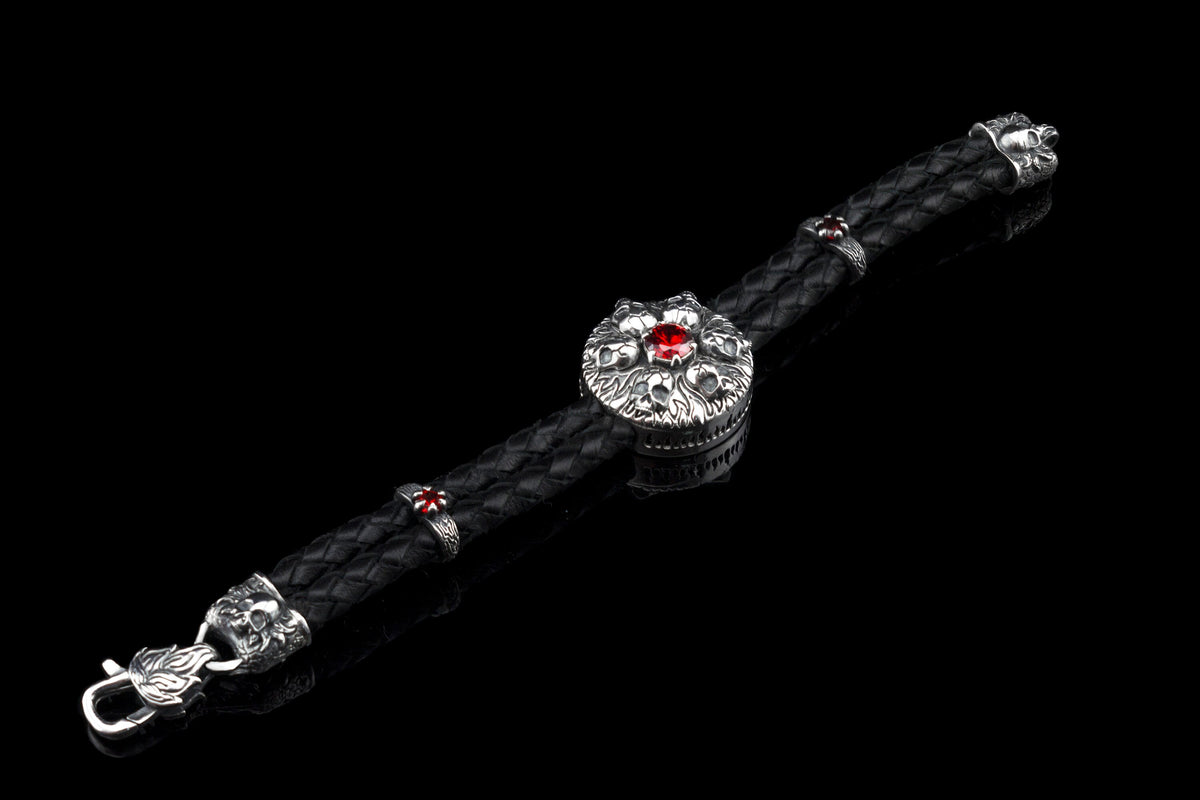 Furious Bonnie bracelet laid flat: silver skull medallion, red stones, skull end caps and clasp