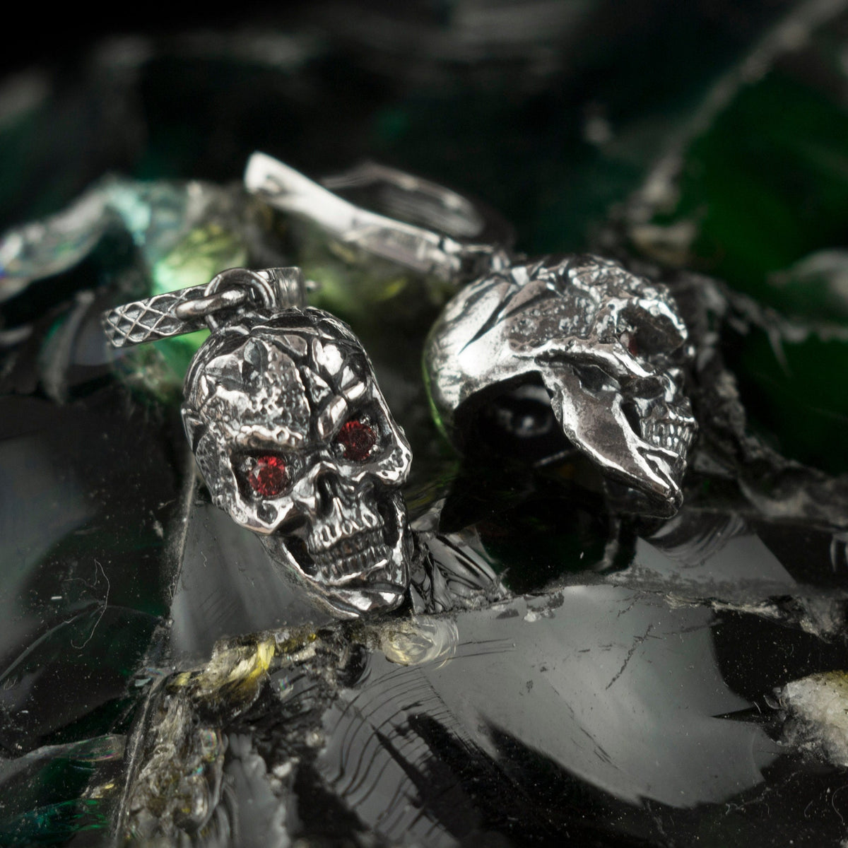 Headhunter skull drop earrings, close-up of the red stone eyes