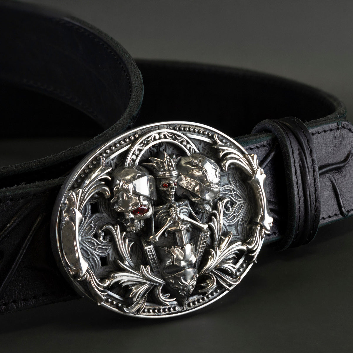 Hear Nothing See Nothing buckle detail with red stone accents