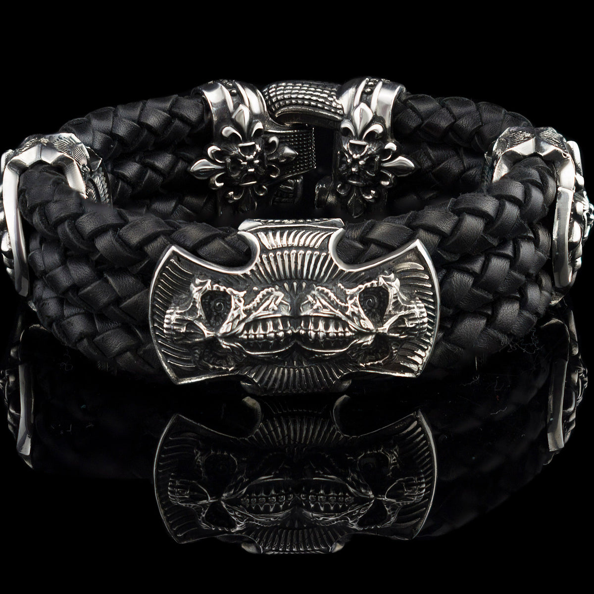 Heavy sterling silver skull bracelet on black braided leather, front