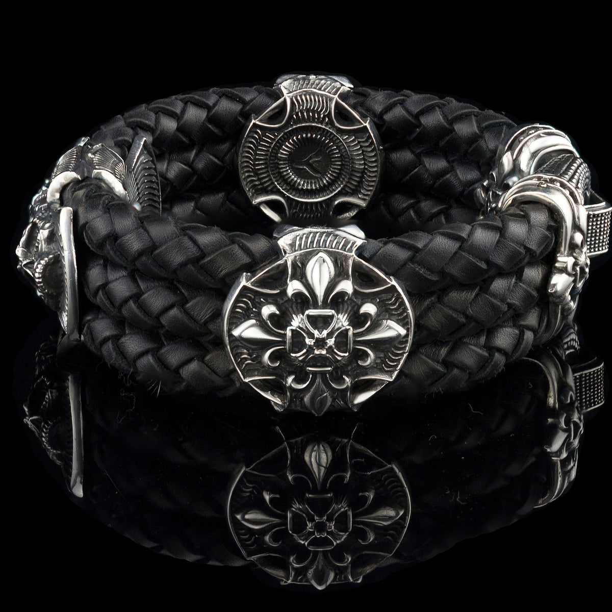 Heavy sterling silver skull bracelet on black braided leather, top
