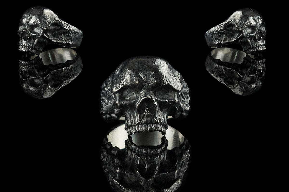 Hellbound sterling silver skull ring shown from front and both sides on black