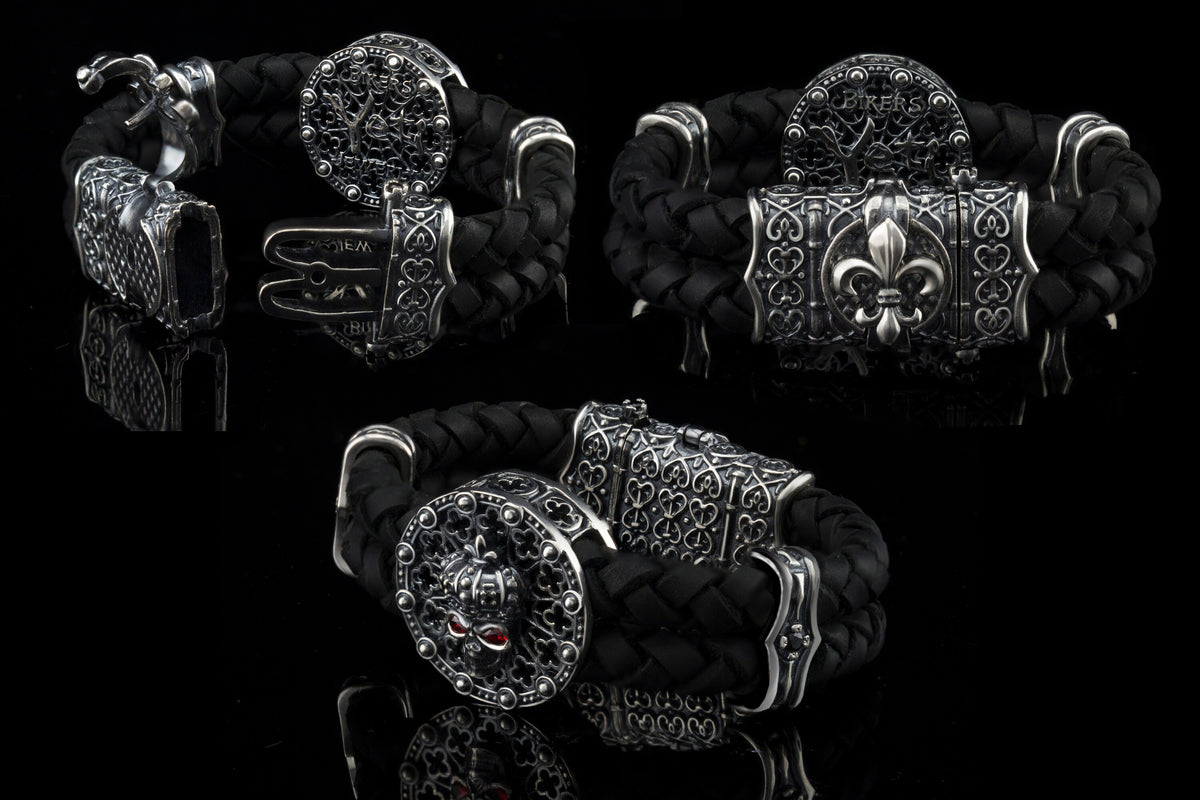 Crowned skull bracelet with 925 sterling silver details, genuine black braided leather and red cubic zirconia eyes
