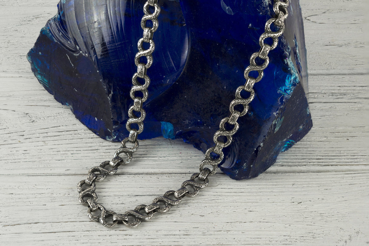 Close-up of large decorative links on a handcrafted 925 sterling silver Infinity chain