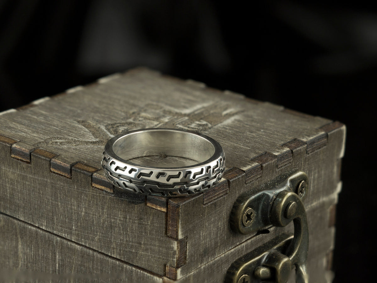 925 sterling silver motorcycle tire ring with deep geometric tread pattern and polished inner band