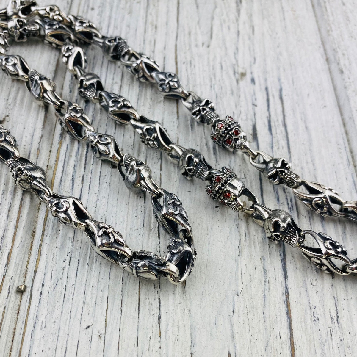 Heavy 925 sterling silver Fleur de Lis and crowned skull chain with detailed gothic links and gemstone skull eyes