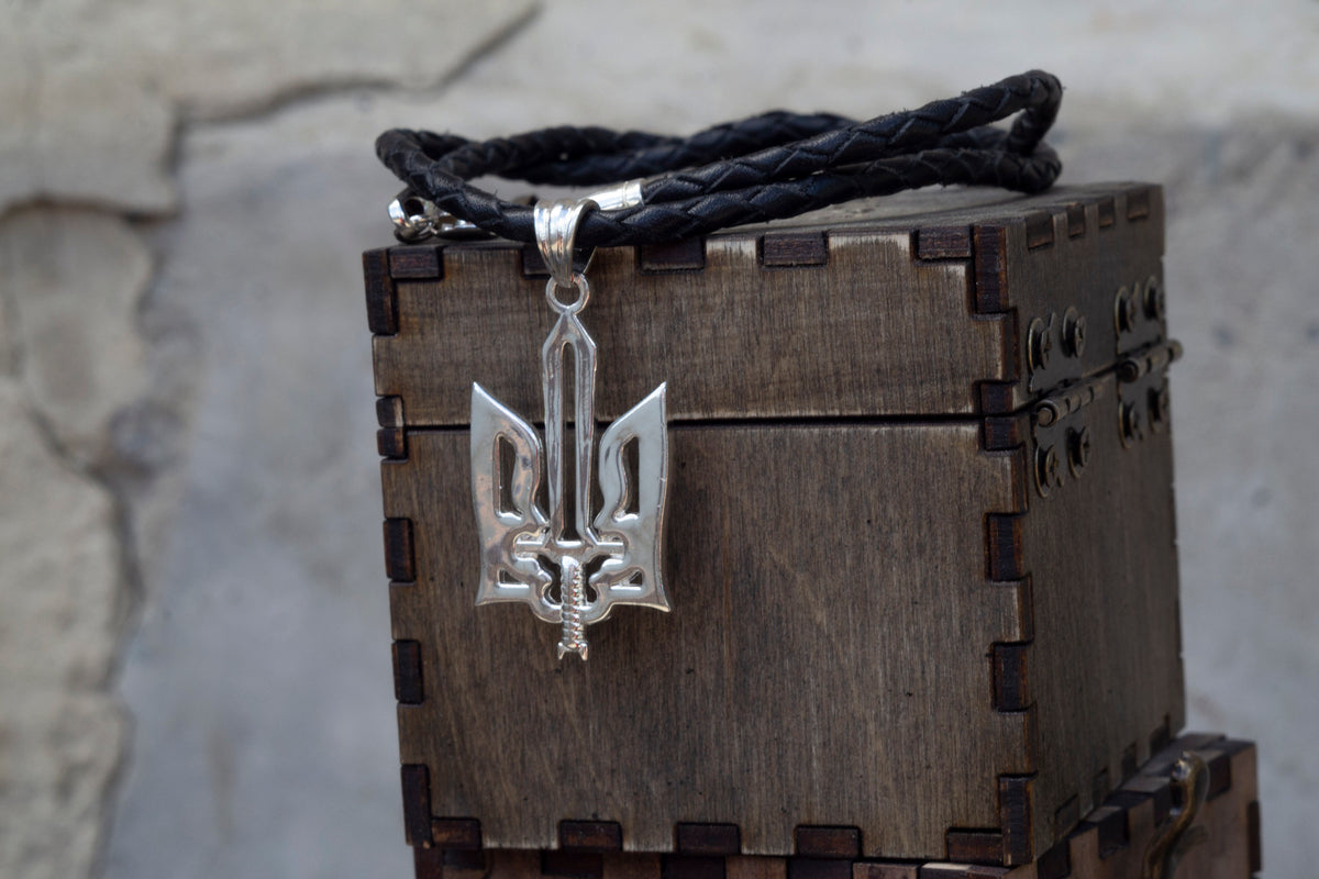Oxidized 925 sterling silver Ukrainian Tryzub pendant with an integrated sword, 36 mm tall