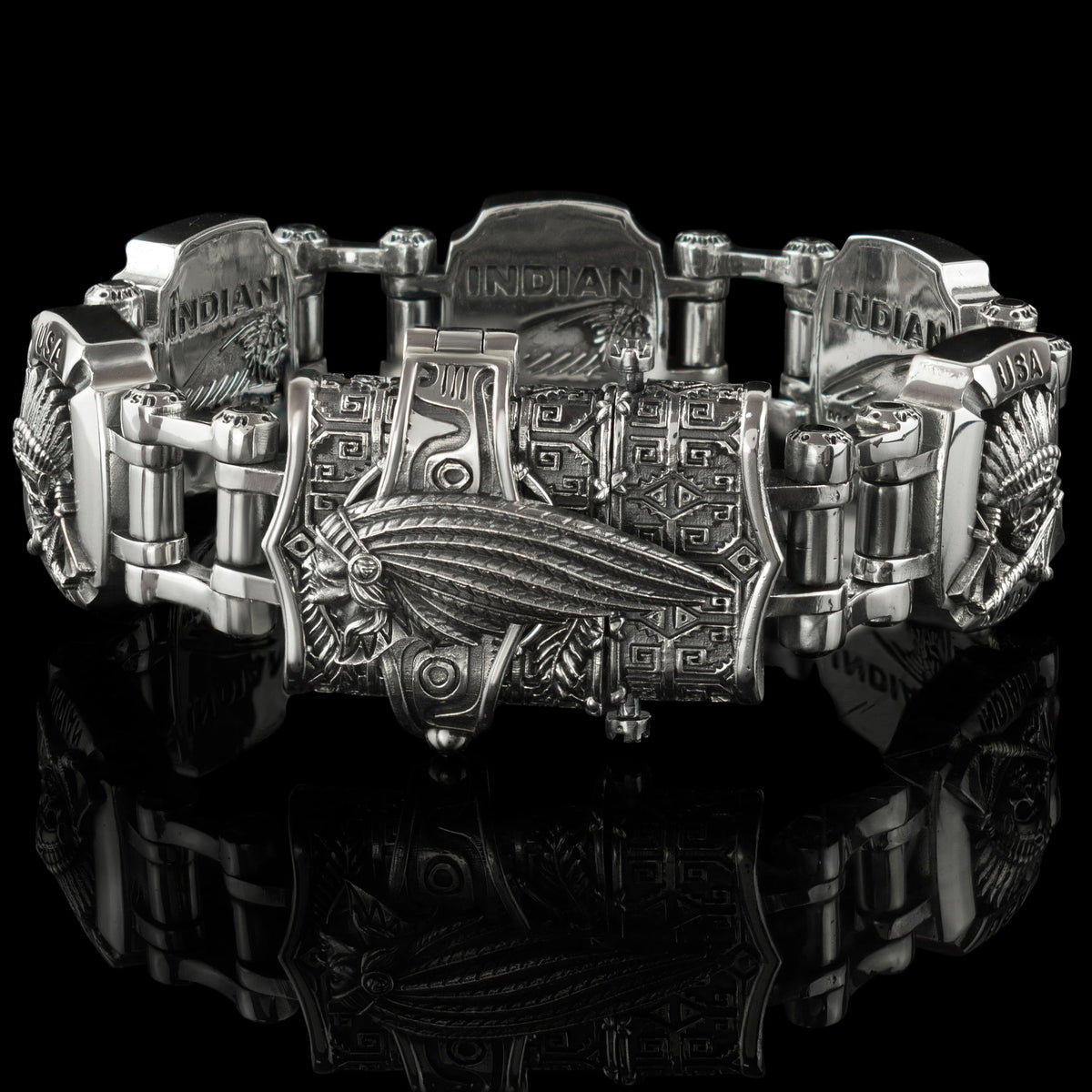 Heavy silver biker bracelet side view on black background