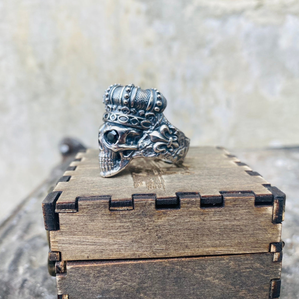 Heavy crowned skull biker ring, three-quarter view