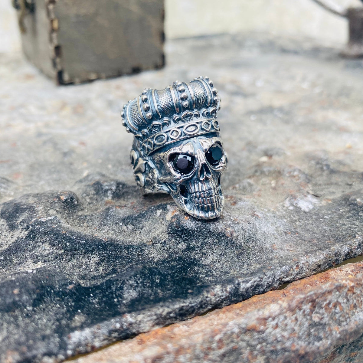 Crowned skull ring side view showing the textured crown