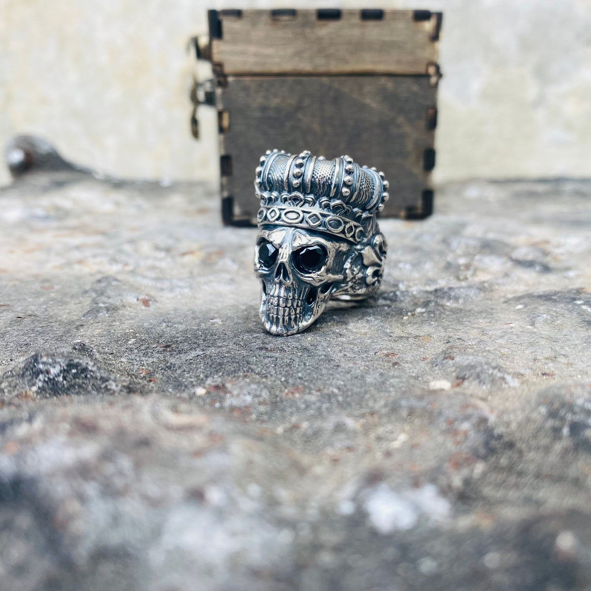 Oxidized silver crowned skull ring, other side view
