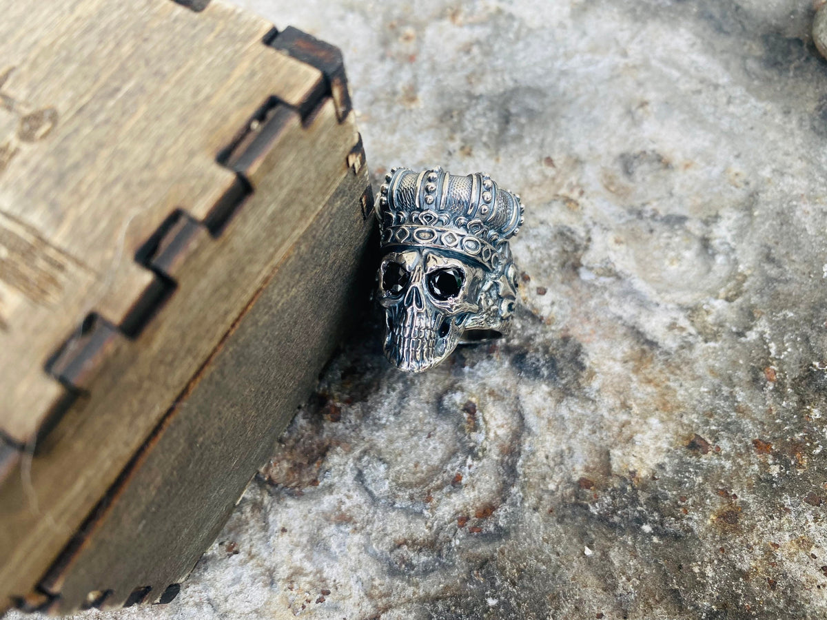 Close-up of the crowned skull face with dark stone eyes
