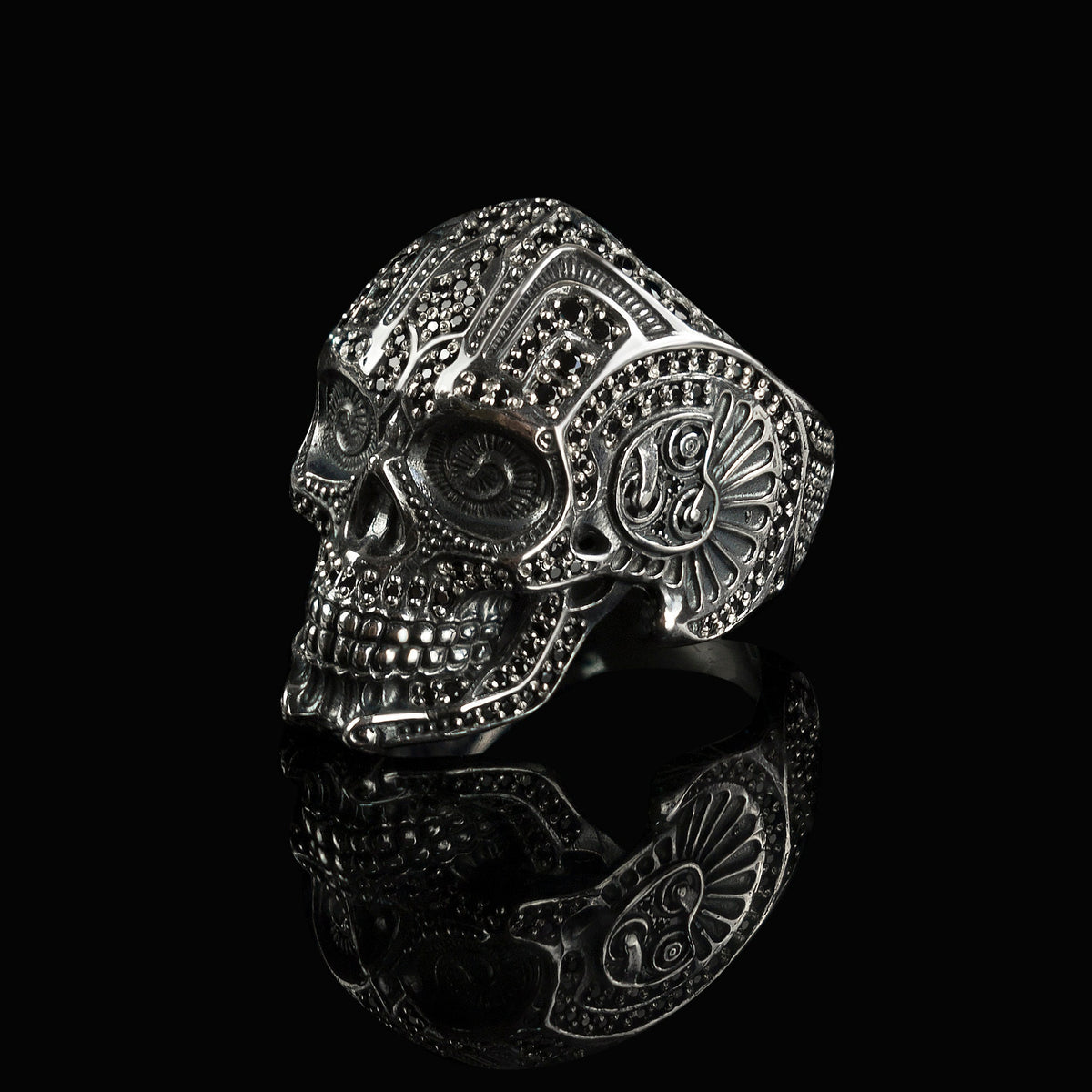 Mexican skull ring side view with ornamental cheek detail