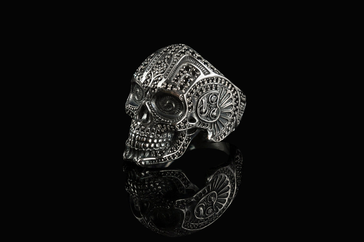 Mexican skull ring side view with ornamental cheek detail