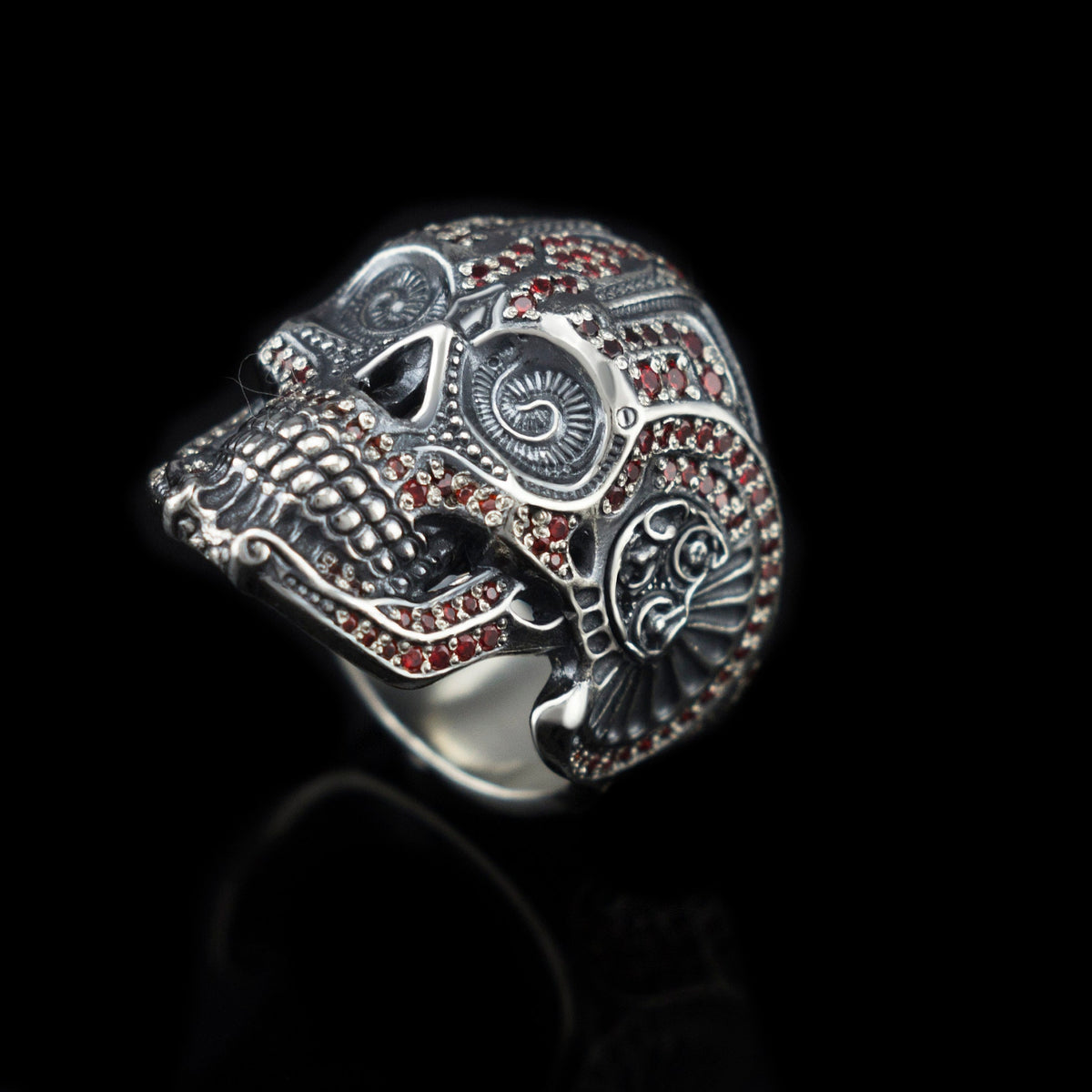 Close-up of the ornate calavera skull face on the silver ring