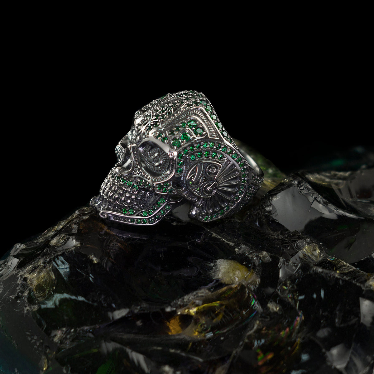 Green stone calavera ring, angled view of the ornate skull