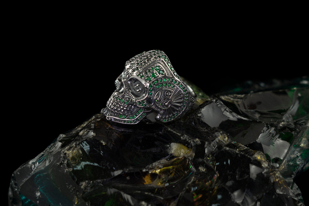 Green stone calavera ring, angled view of the ornate skull