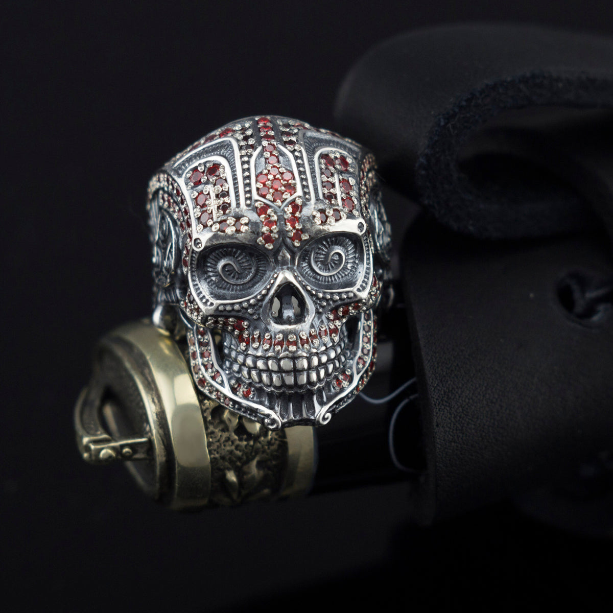 Sterling silver sugar skull ring front view with red stones