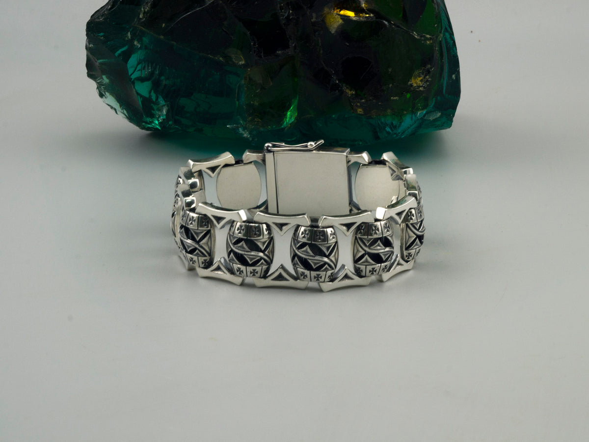 Heavy men's Maltese cross bracelet, side view of the closed box clasp