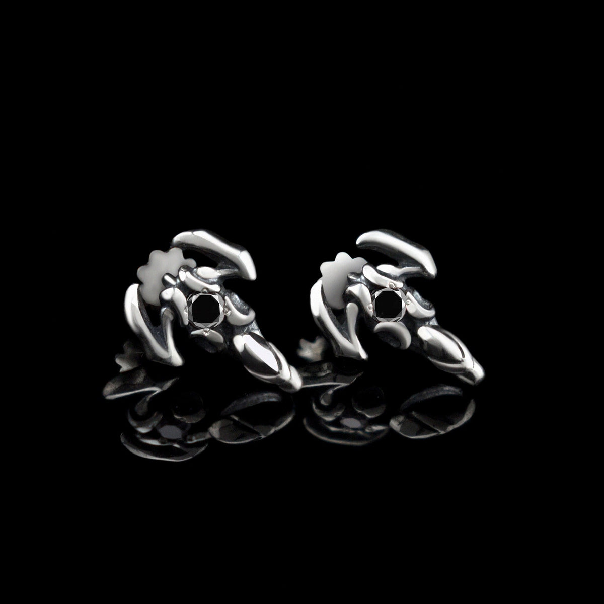Silver scorpion stud earrings with black cubic zirconia