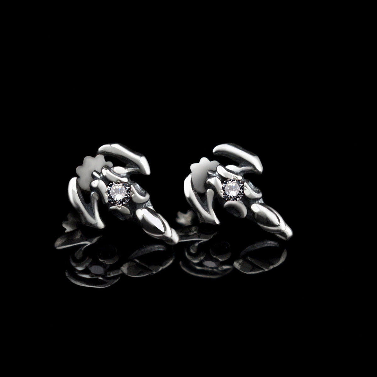 Silver scorpion stud earrings with clear cubic zirconia