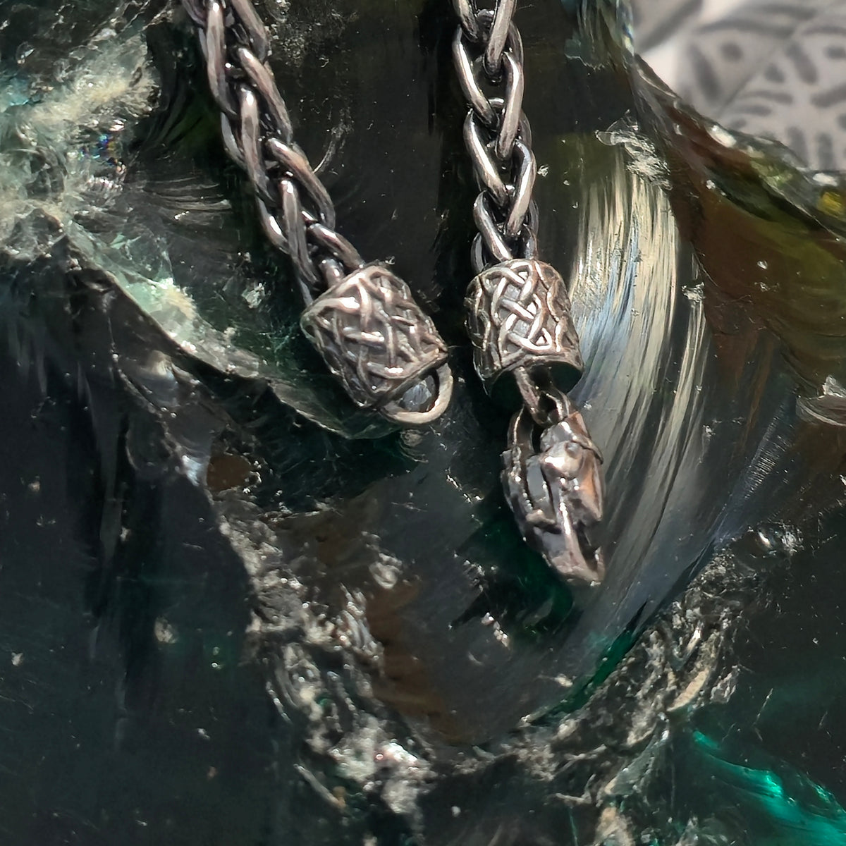 Close-up of the animal head chain terminals at the clasp of the Thor necklace set