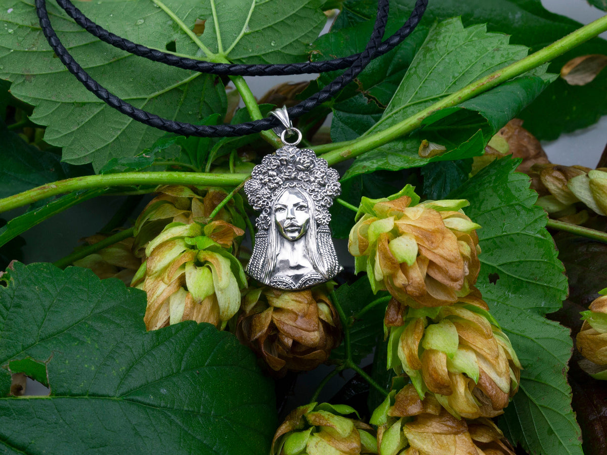 Sterling silver pendant of a Ukrainian woman with a floral wreath, detail