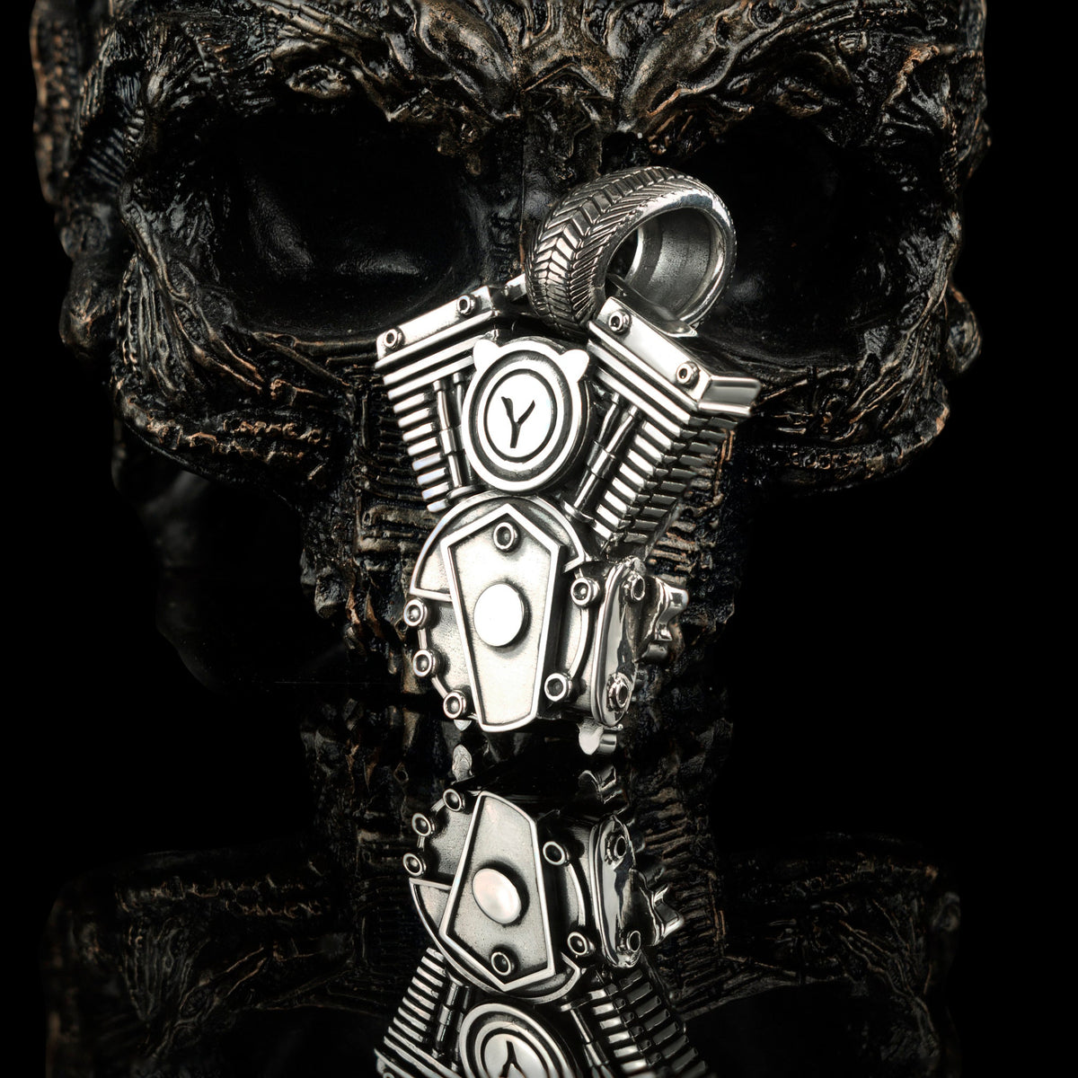 Vigor pendant on black with reflection, V-twin and skull detail