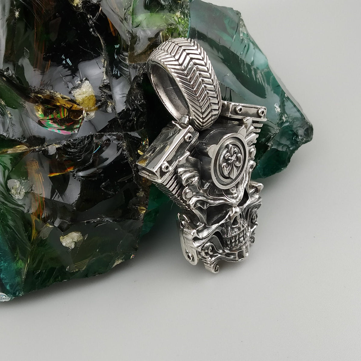 V-twin skull pendant angled view with engine details and bail