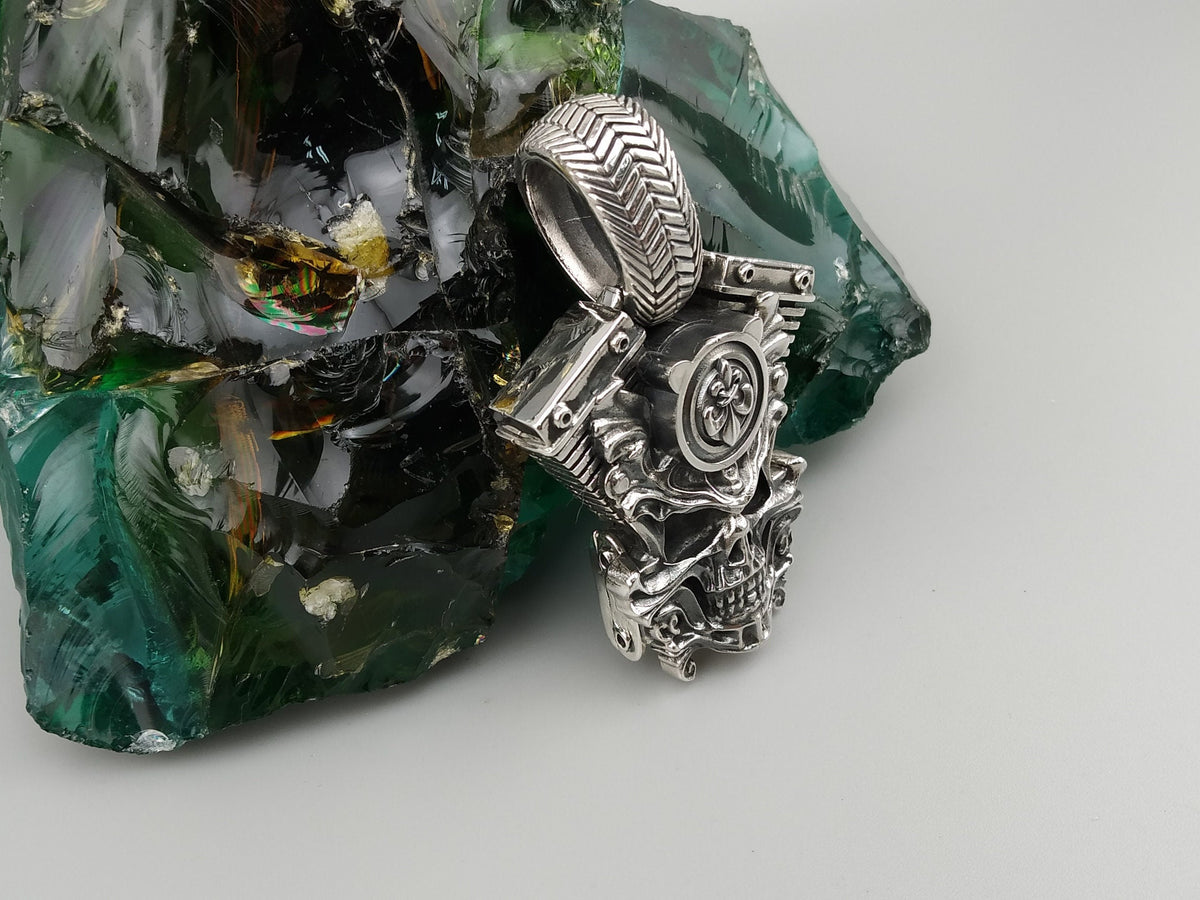 V-twin skull pendant angled view with engine details and bail