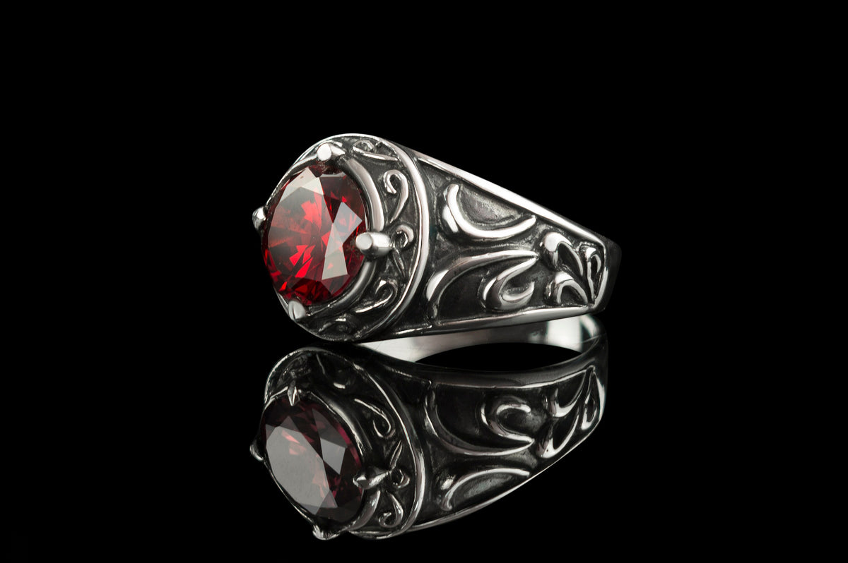 Men's Viking silver ring with red stone, opposite angle with reflection