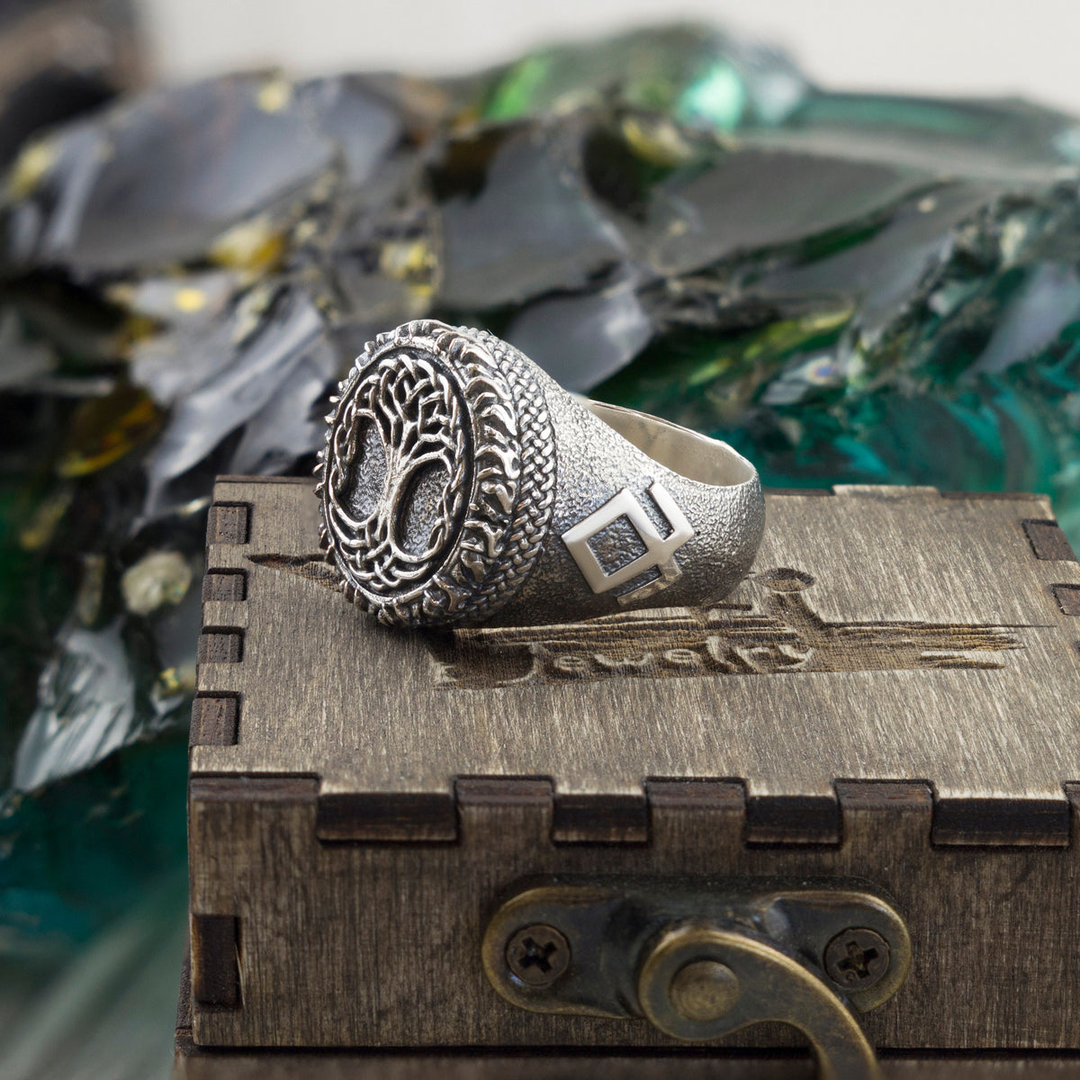 Yggdrasil silver ring angled view with Celtic knotwork shoulders