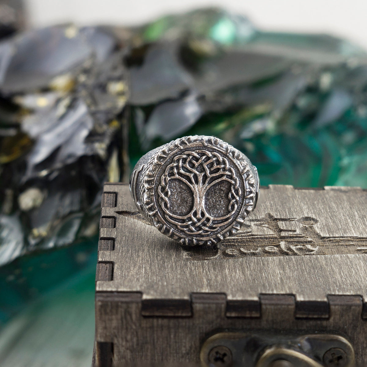 Yggdrasil ring on a wooden box, front view of the Tree of Life