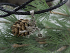 Allegra sterling silver witch pendant, side view of the motorcycle