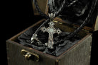 Aurora silver cross pendant with white center stone on a leather cord in a gift box