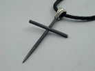 Black Spike sterling silver cross pendant, angled view of the textured matte finish
