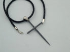 Black Spike oxidized sterling silver cross pendant with ribbed bail on a black braided leather cord
