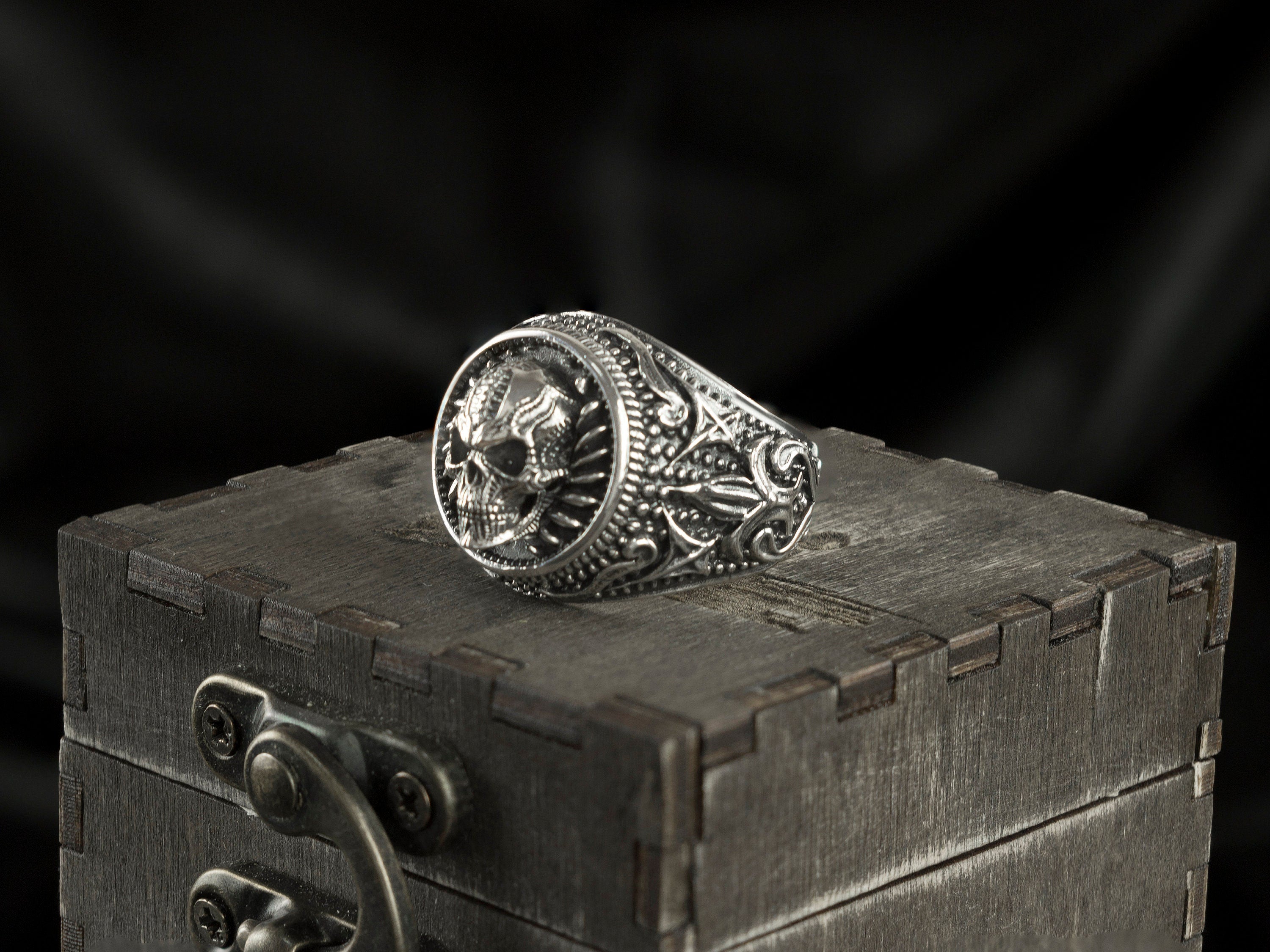 Blade Boss ring angled view showing the skull and textured radial border