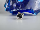Shield skull ring lying on its side, inside of the band