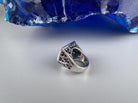 Shield skull ring side view with ornate openwork shoulder