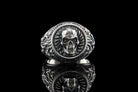 Blade Boss skull ring front view on black with reflection