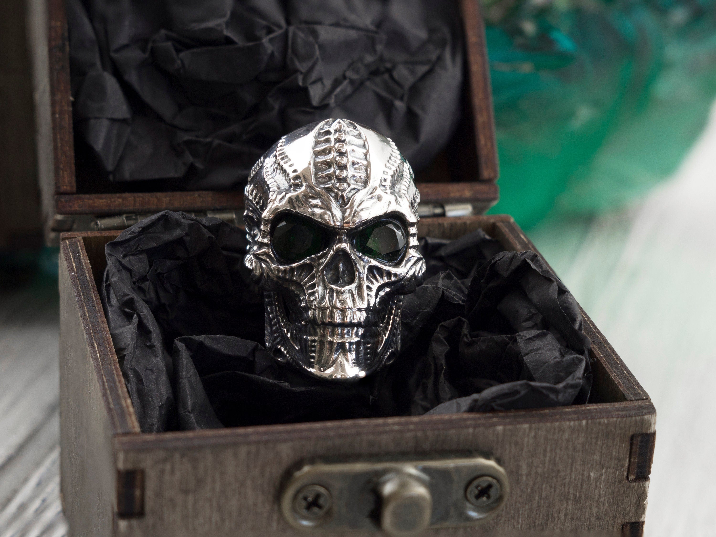 Blade skull silver ring in an open wooden gift box