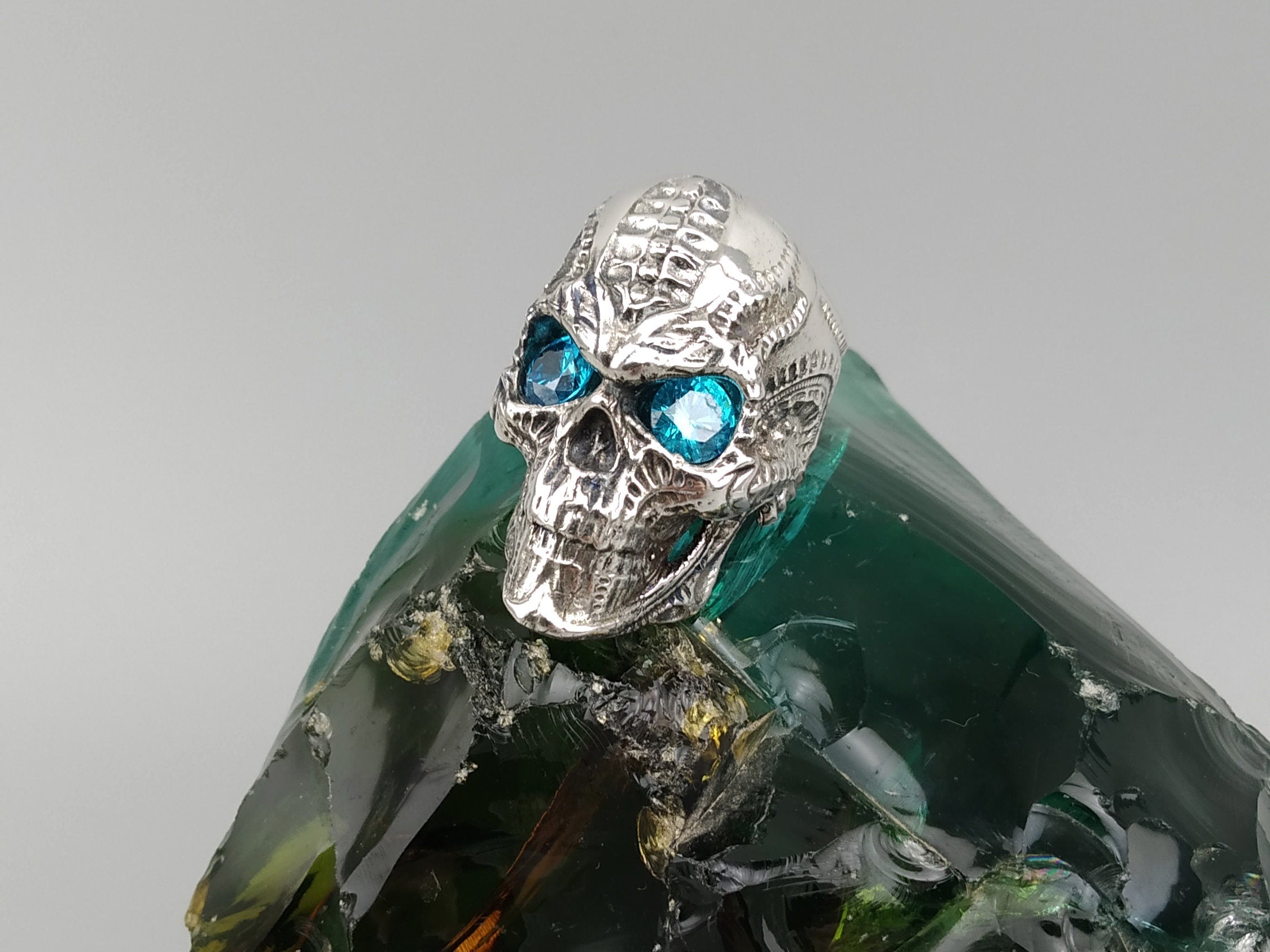 Blade biomechanical skull ring with light blue cubic zirconia eyes