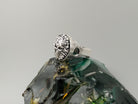 Blazing sterling silver skull ring, angled view of top and shoulder